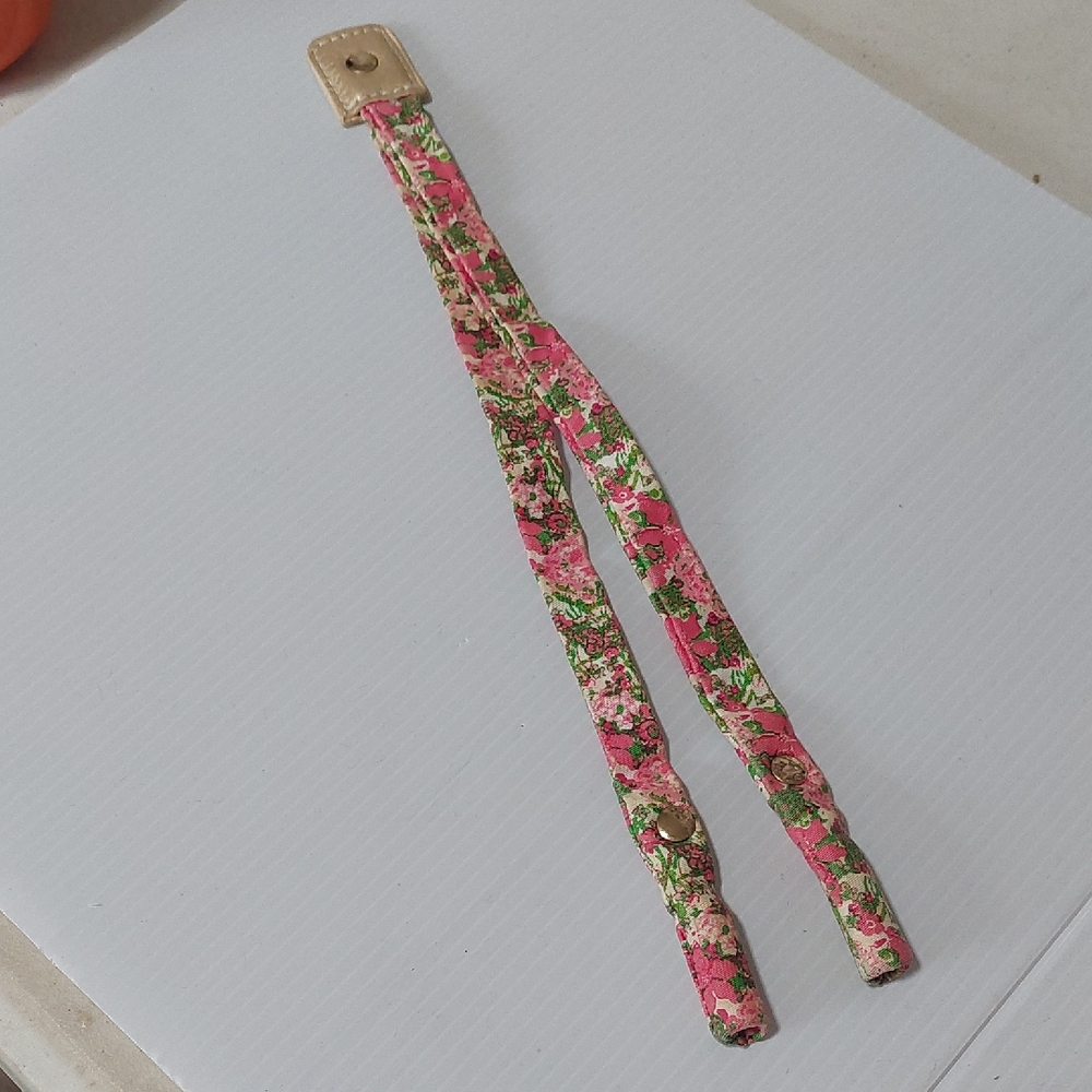 Lilly Pulitzer floral sunglass strap with pink and green colors.